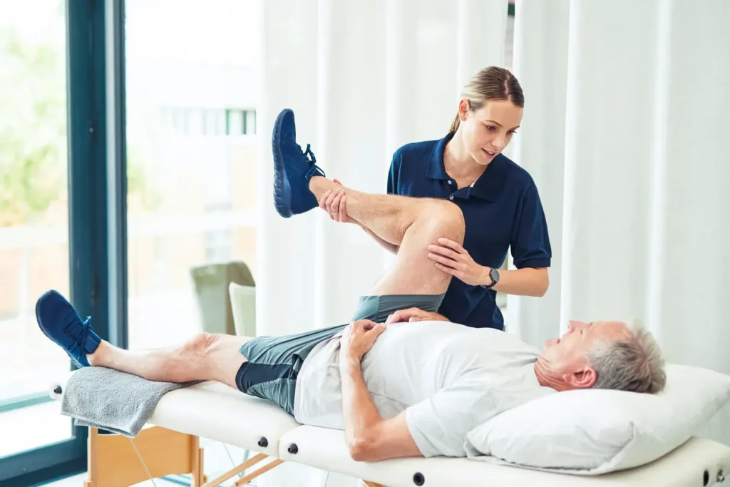 Revitalising Recovery: Effective Rehabilitation Strategies for Muscle Injuries 3 Physiotherapist assisting a patient with muscle recovery exercises Woking