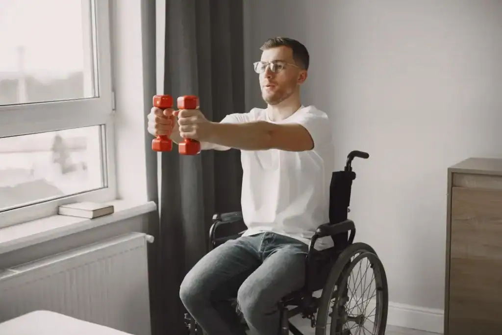 Empowering Weight Loss: A Comprehensive Guide for Individuals with Disabilities 1 Image of man doing exercise in his wheelchair to aid weight loss Woking