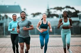 Sculpting Sleek Arms: The Essential Role of Cardio in Toning Without Bulking Up 3 image of people running to incorporate cardio Woking exercise into their life to help tone arms and body.